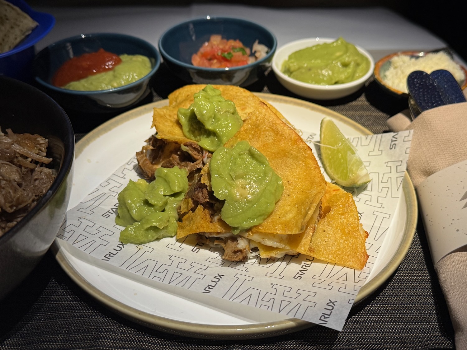 a plate of food with different sauces