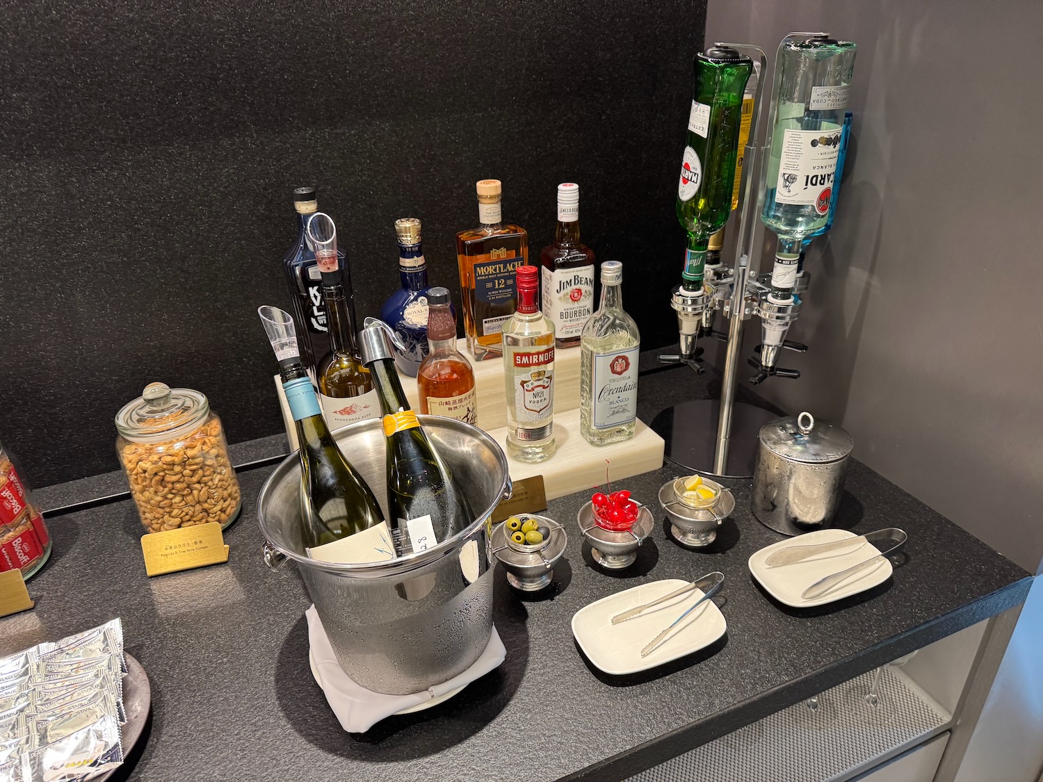 a group of bottles in a bucket on a counter