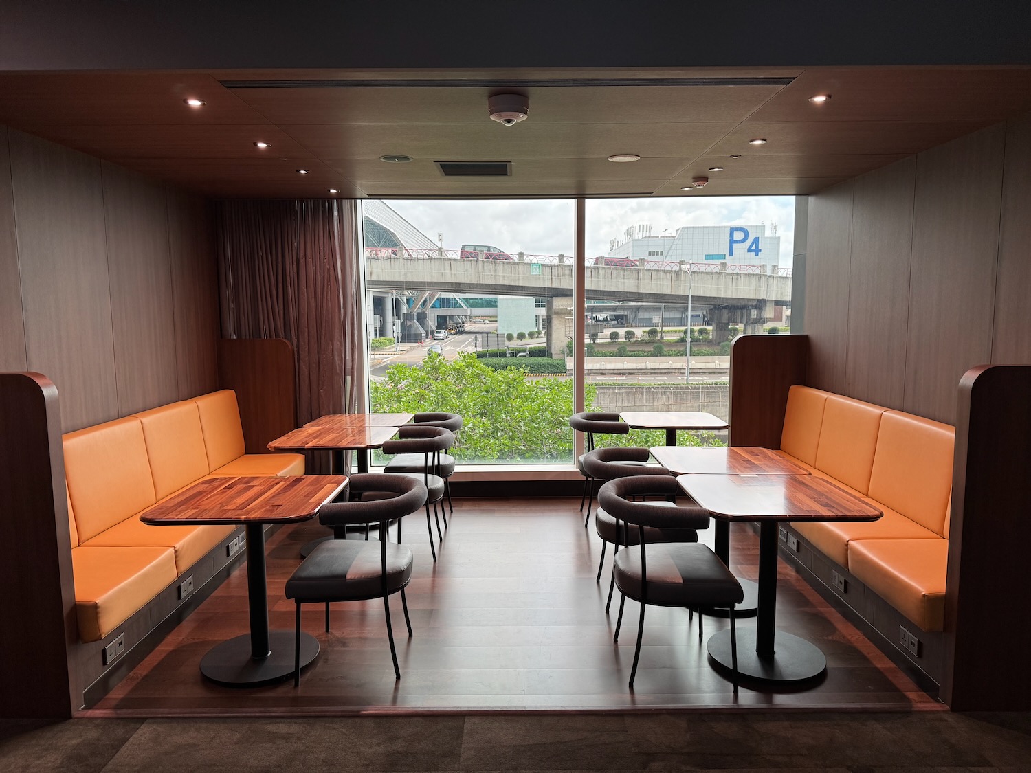 a room with tables and benches