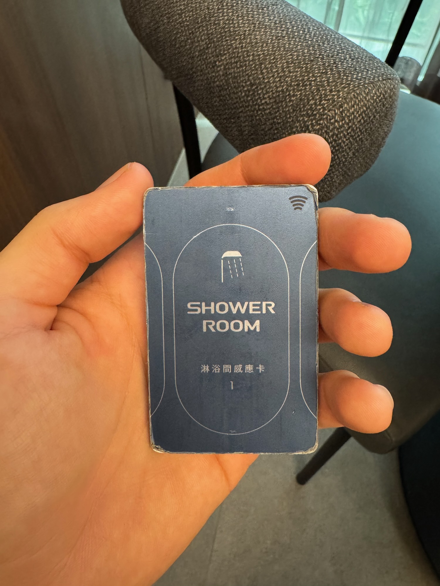 a hand holding a card