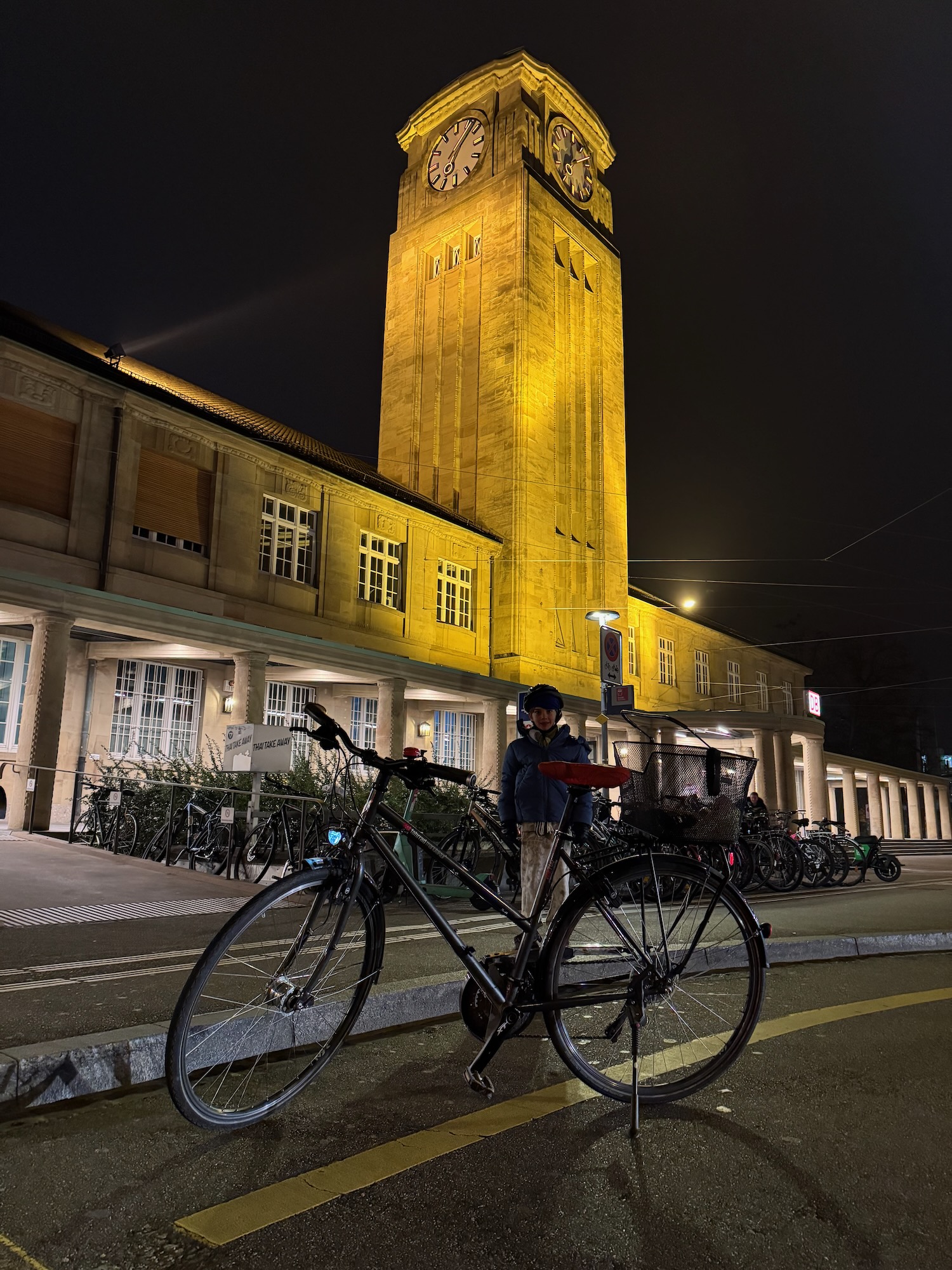 a person standing next to a bicycle