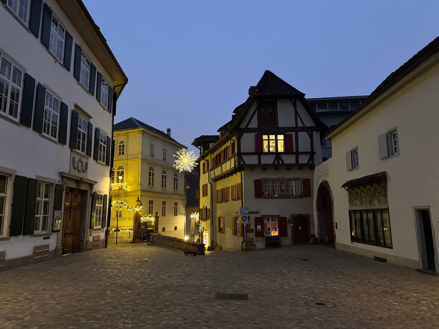a street with buildings and lights
