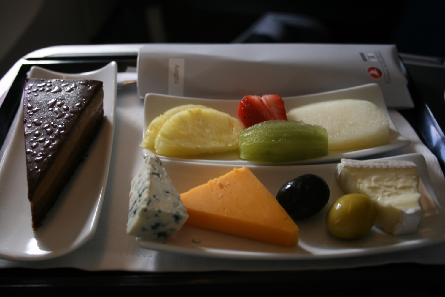 a plate of fruit and cheese