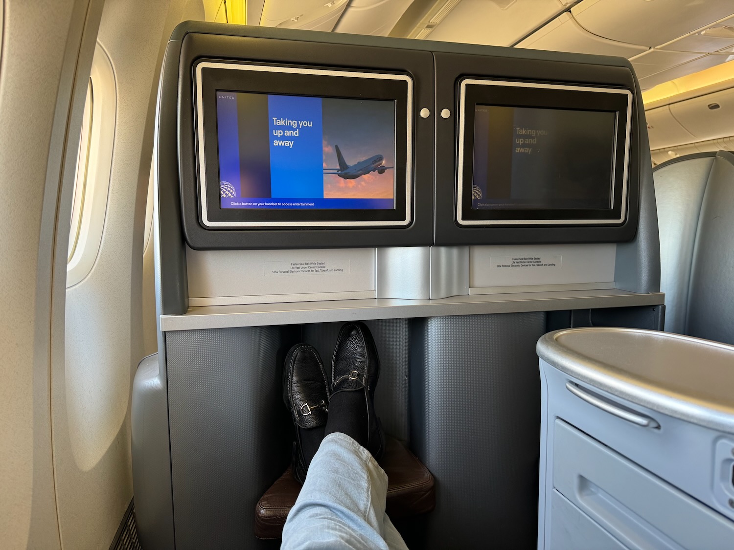 a person's feet on a tv screen