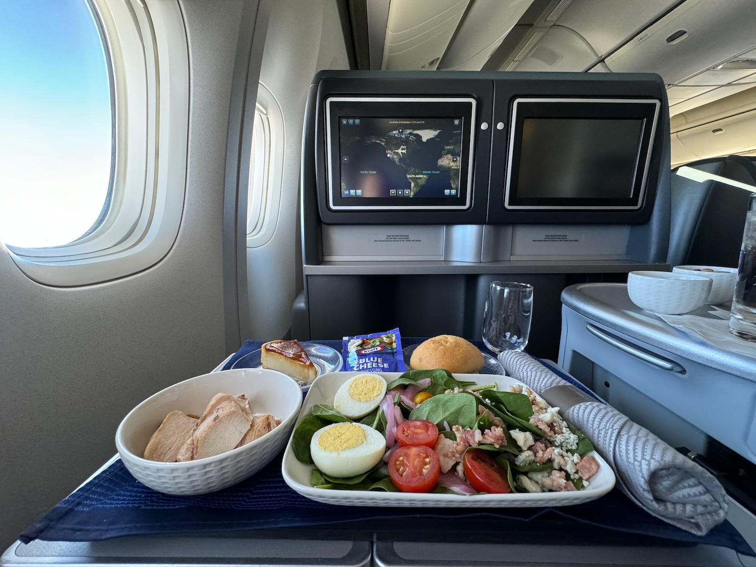a tray of food on a tray in an airplane