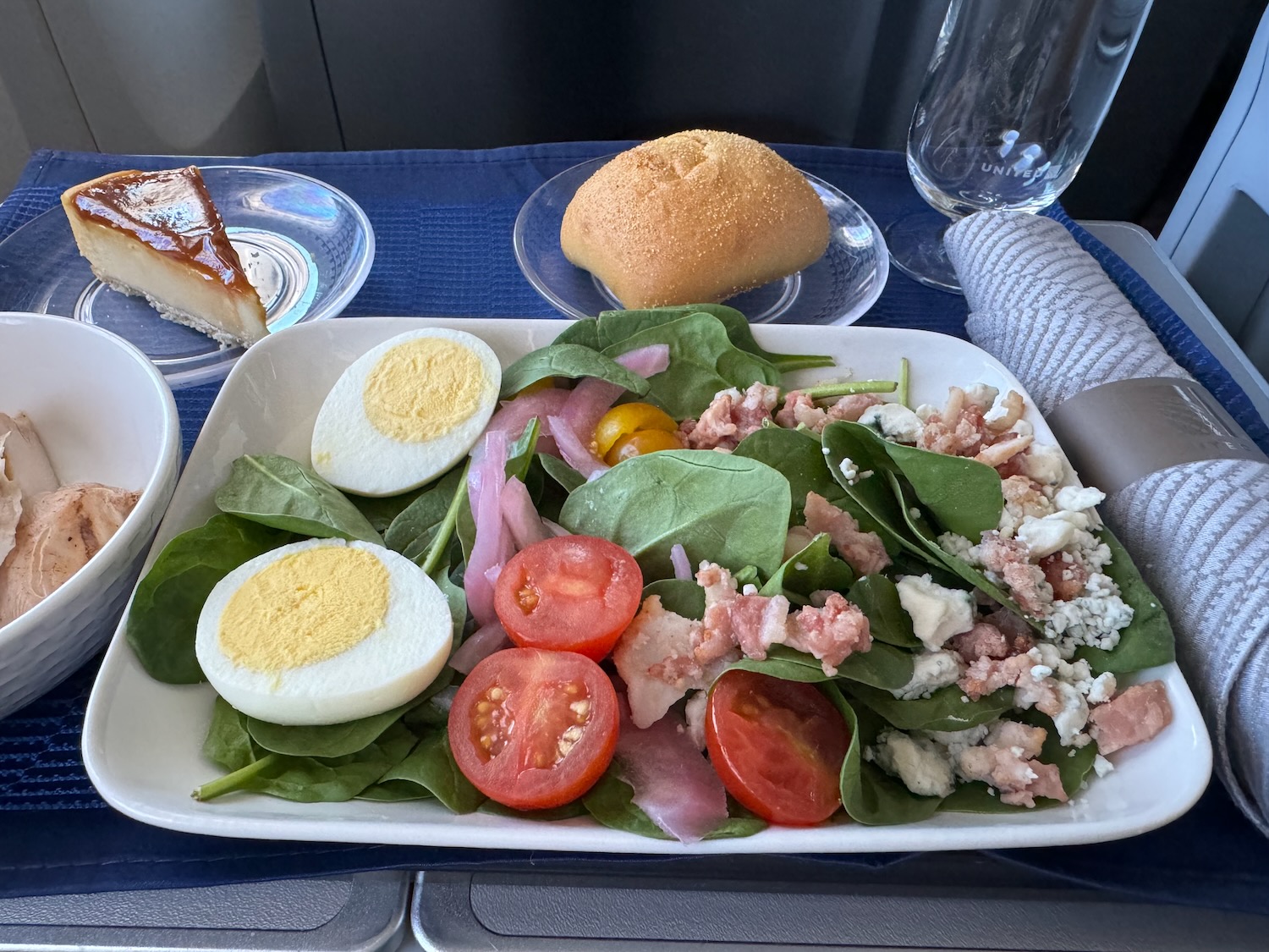 a plate of salad with eggs and tomatoes