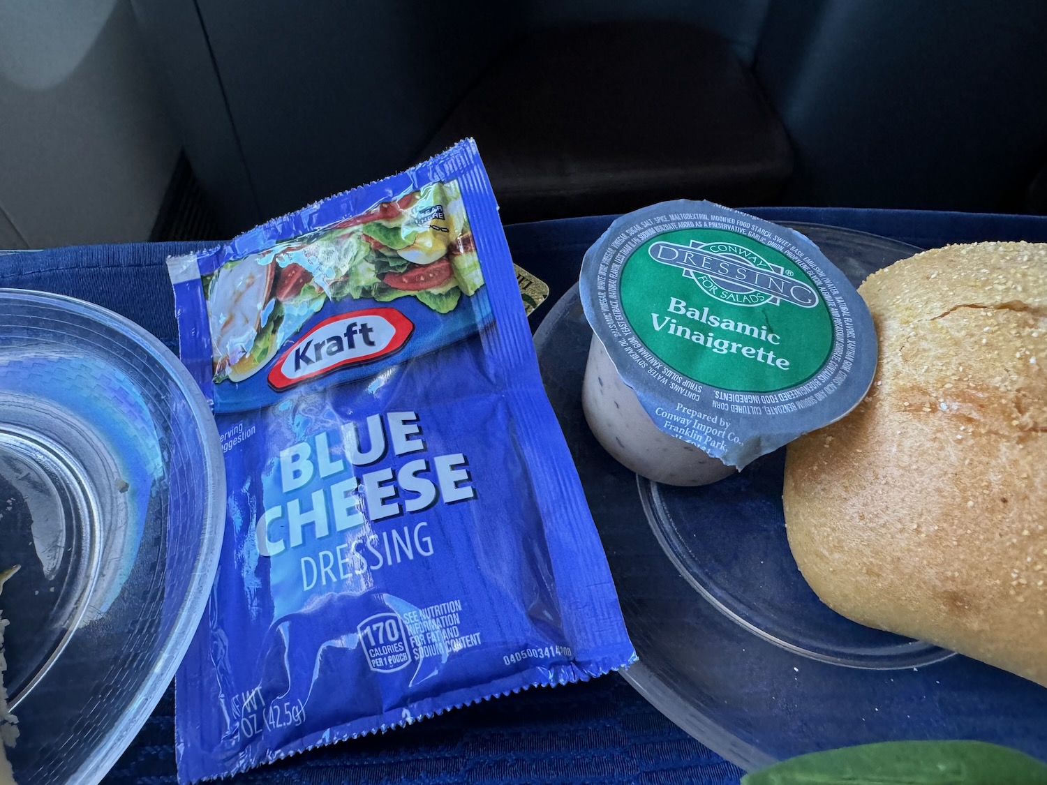 food on a plate with a bagel and a cheese spread
