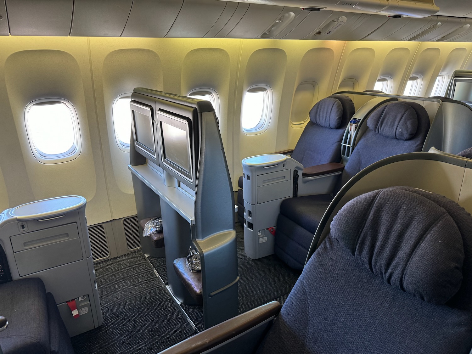 the inside of an airplane with seats and windows
