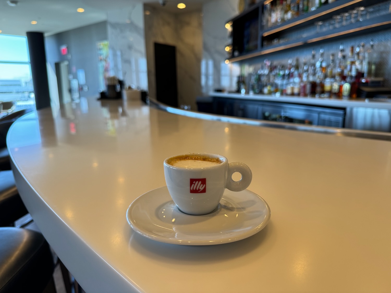 a cup of coffee on a white table