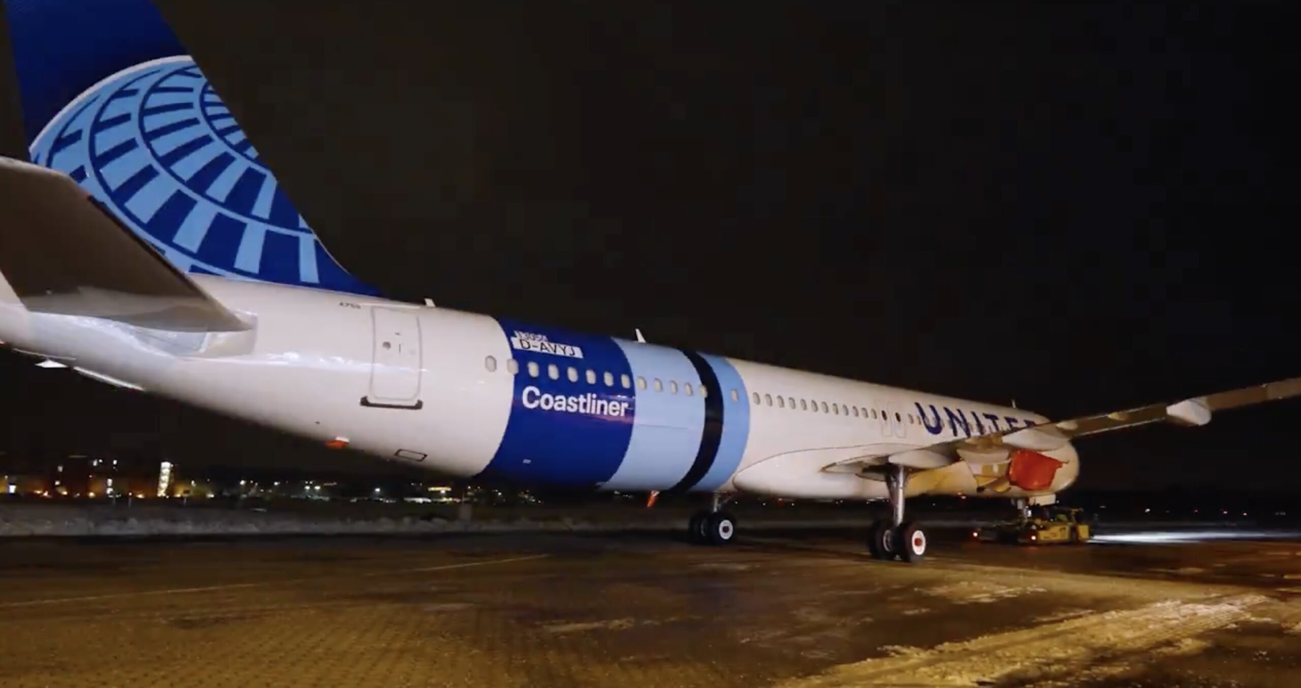 a plane on the runway at night