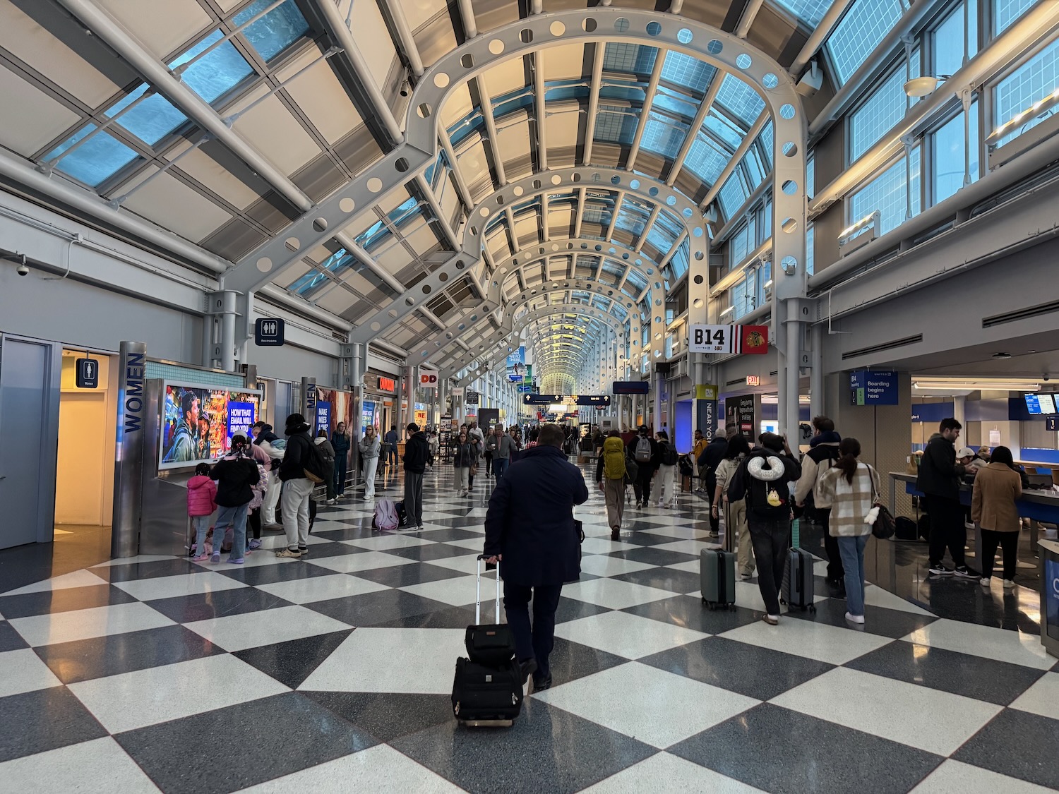 a group of people walking in a terminal
