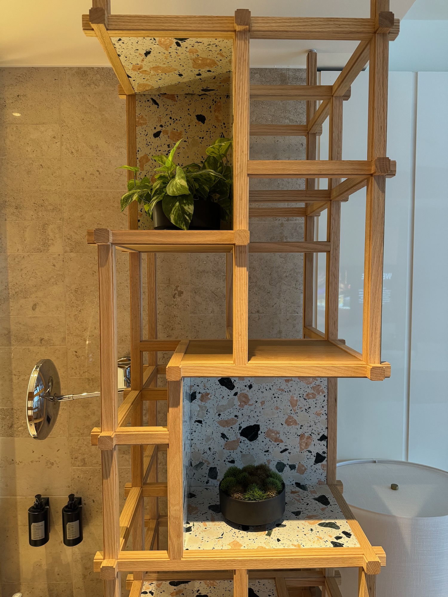 a wood shelf with plants on top