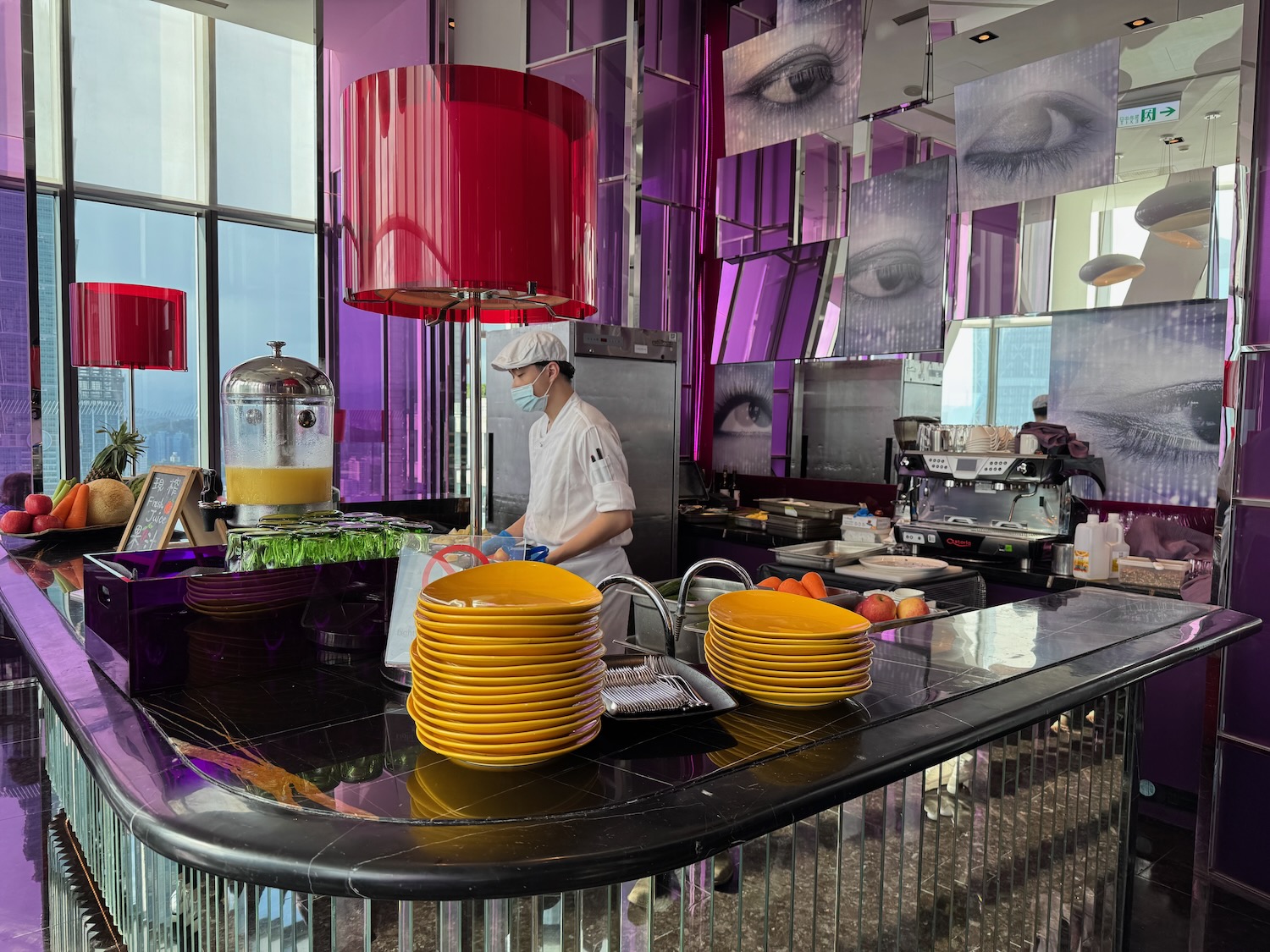 a man in a white uniform and mask standing in a kitchen