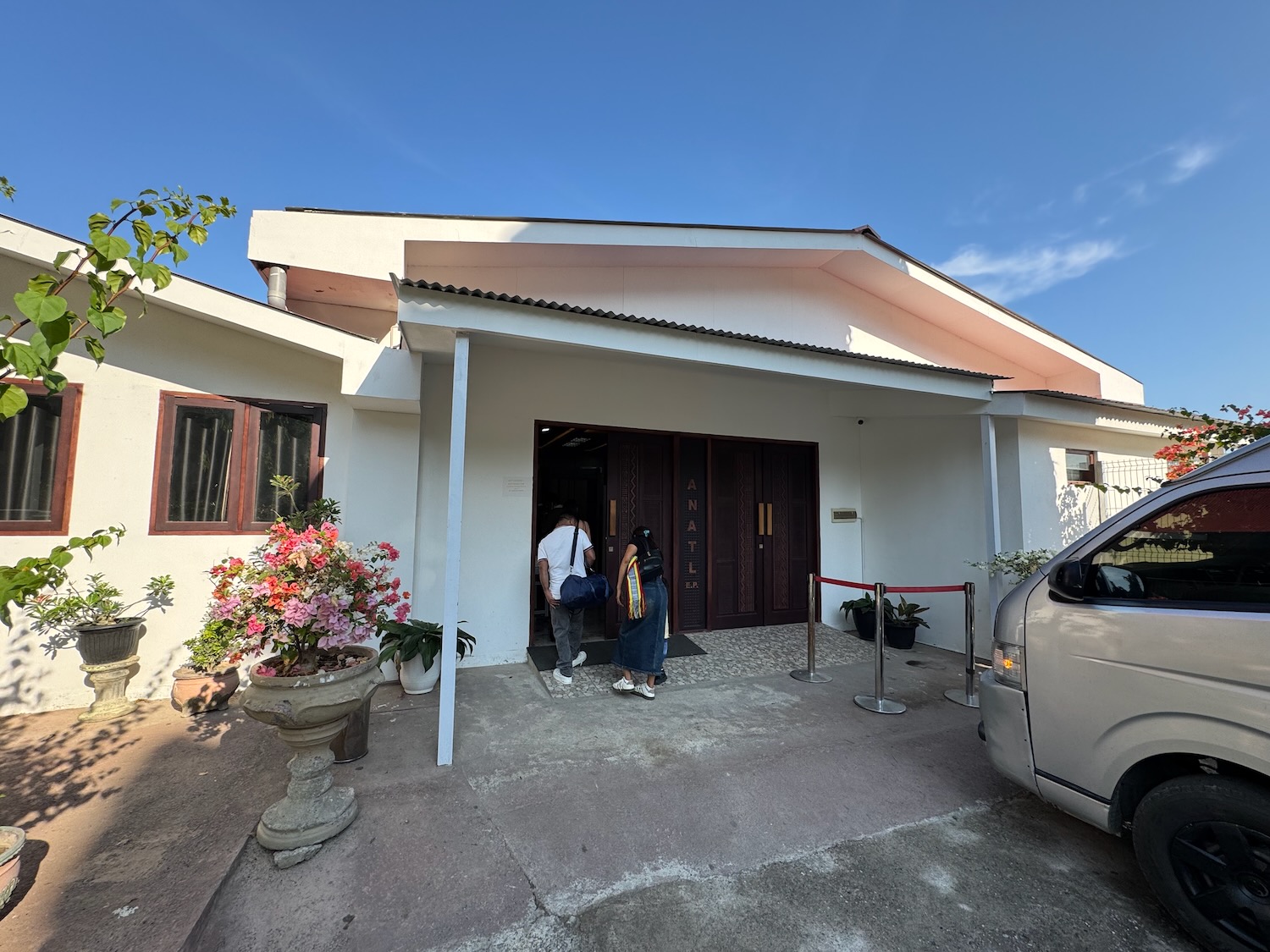 a couple of people walking into a house