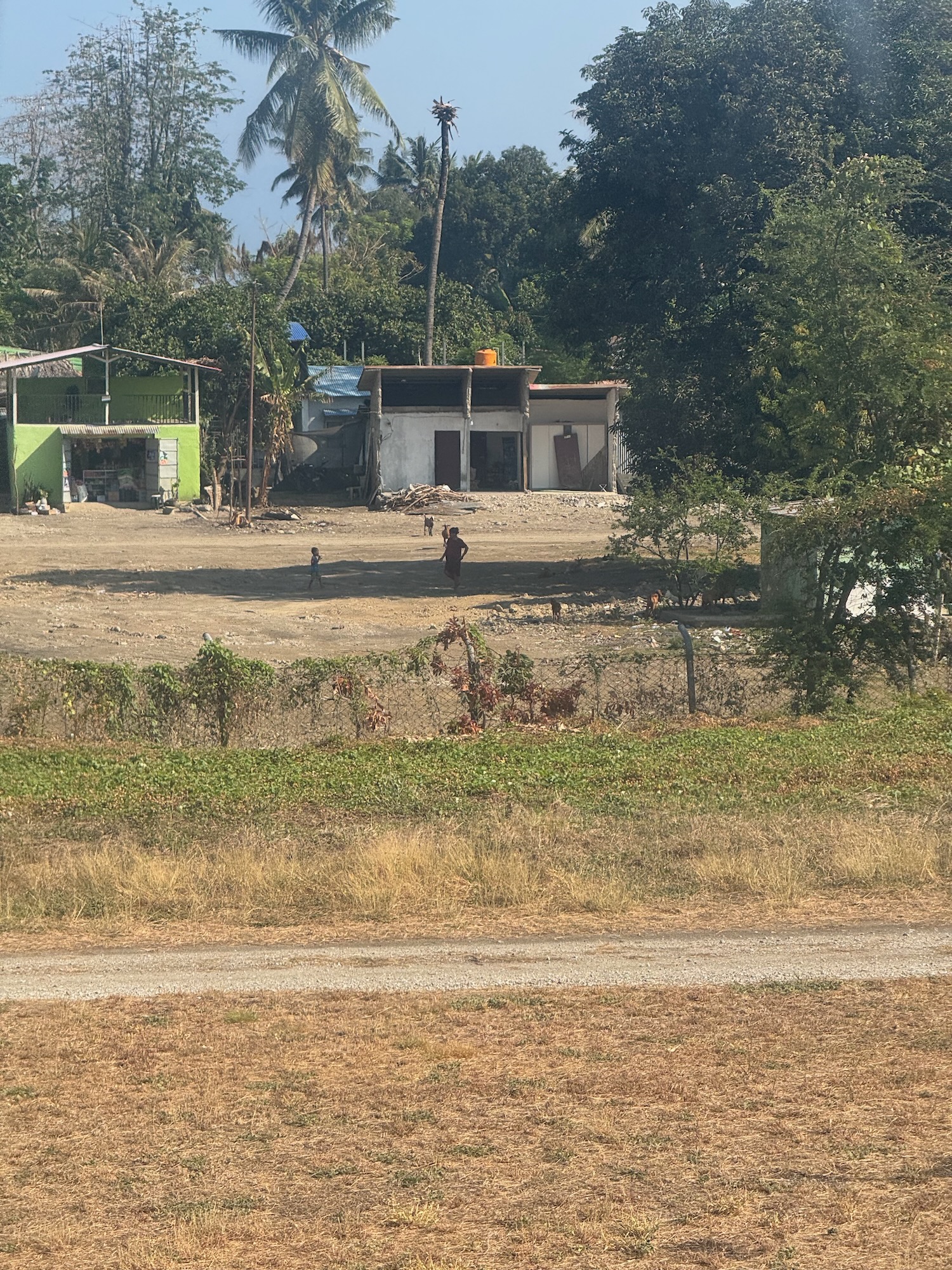 a person walking in a dirt field