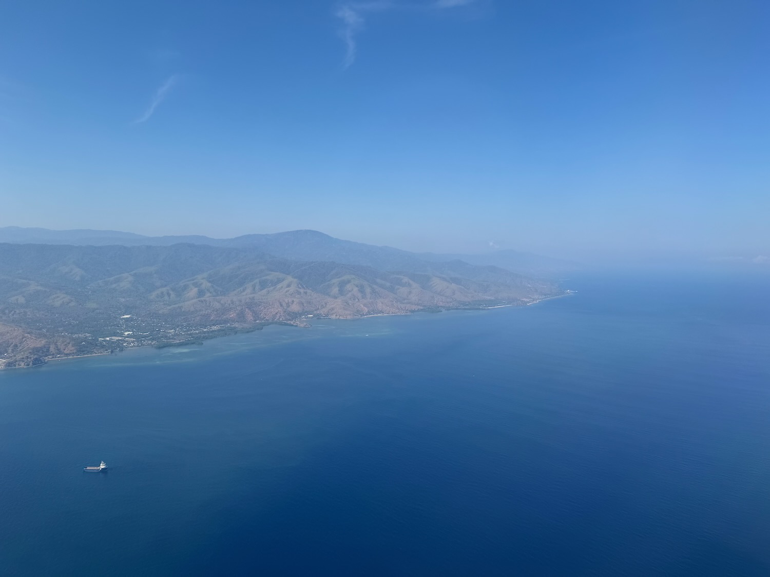 a body of water with a body of water and a boat in the middle
