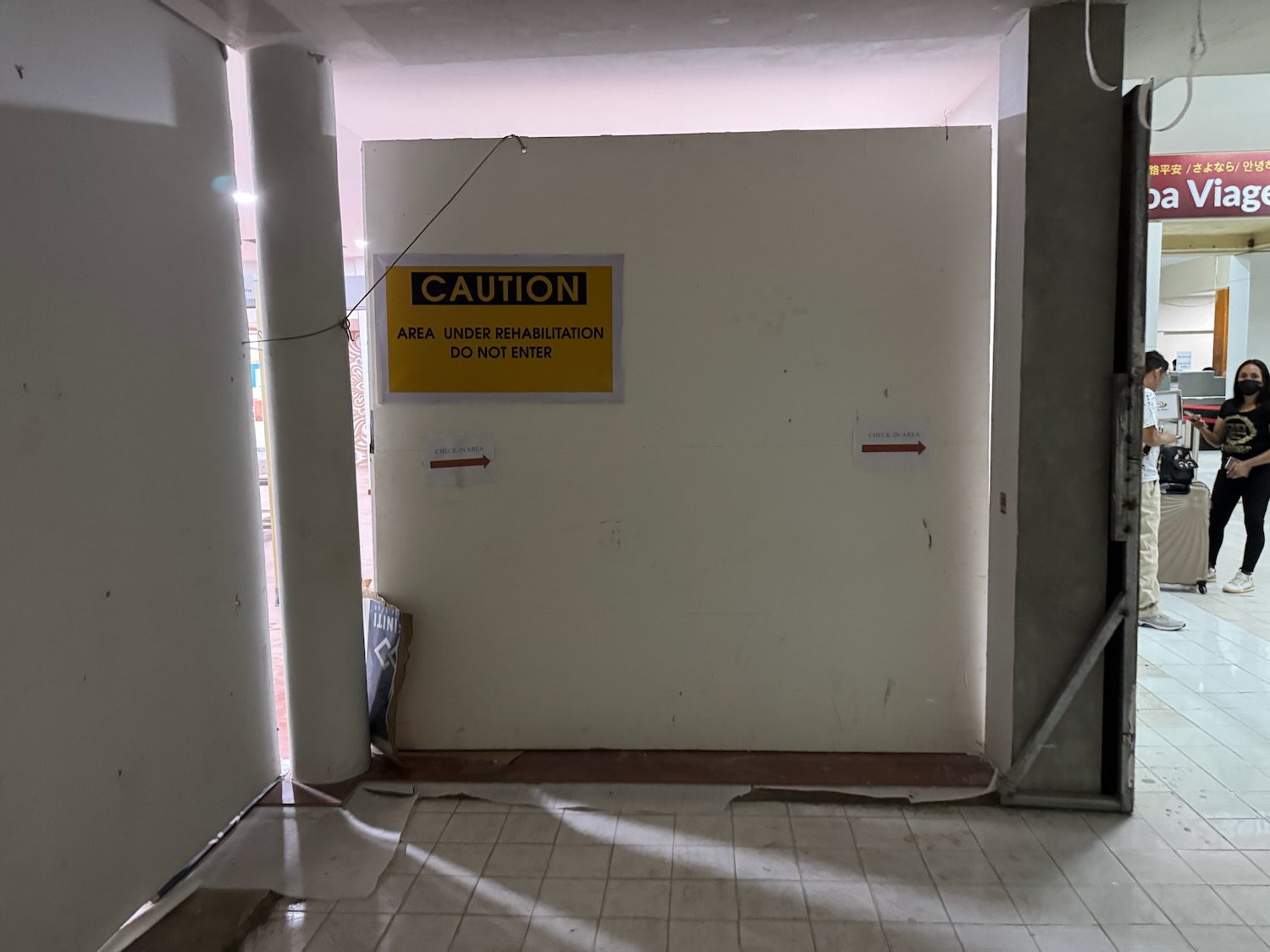 a yellow sign on a wall