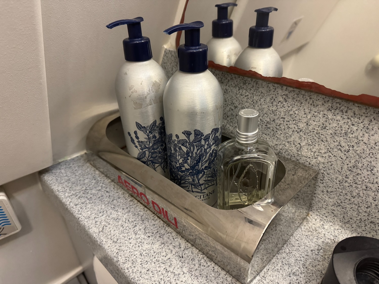 a group of bottles in a metal container