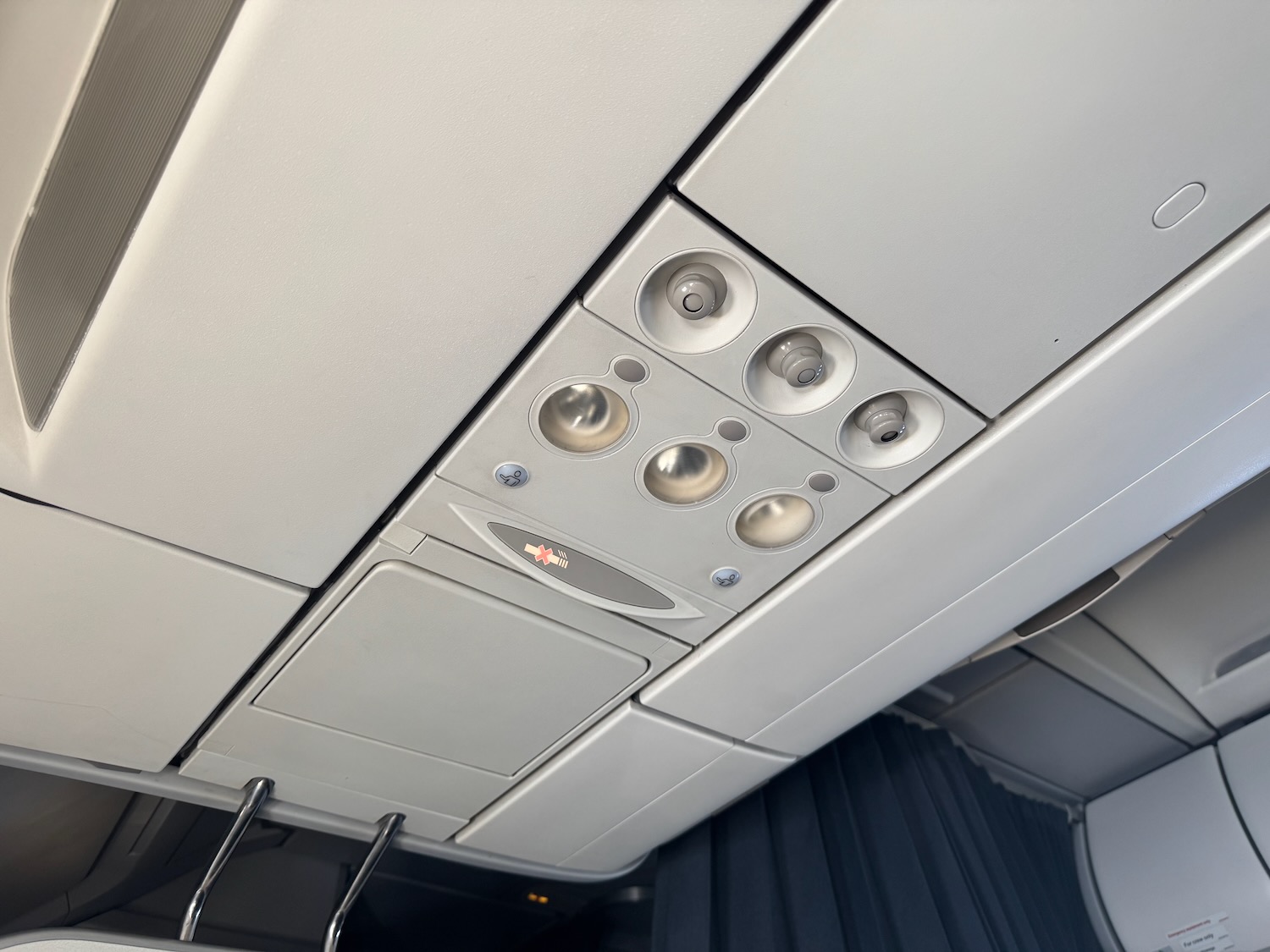 a ceiling with lights and a sign