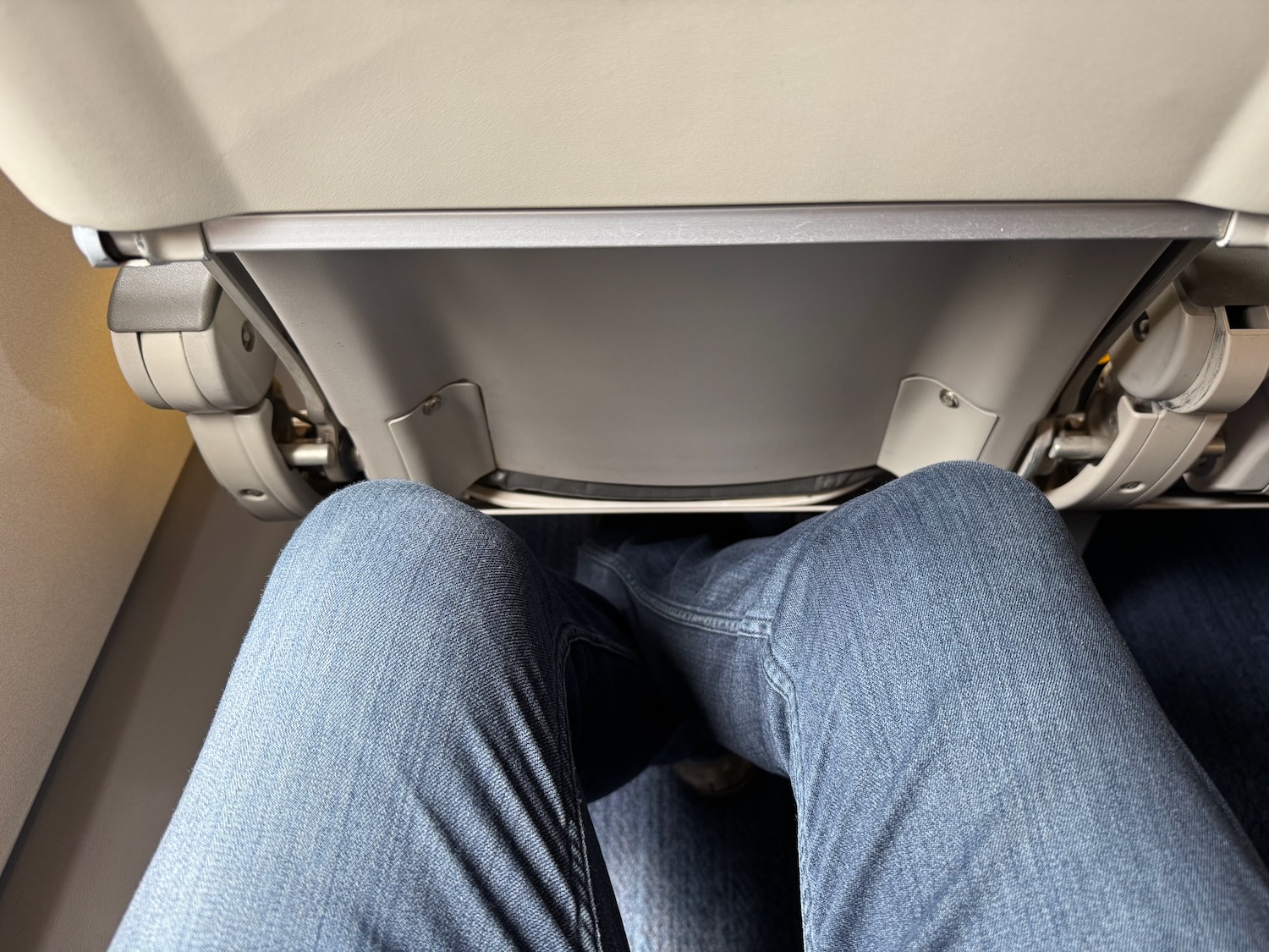 a person's legs in a seat