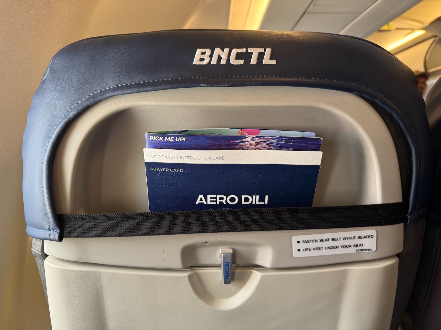 a seat with a passport and tickets inside