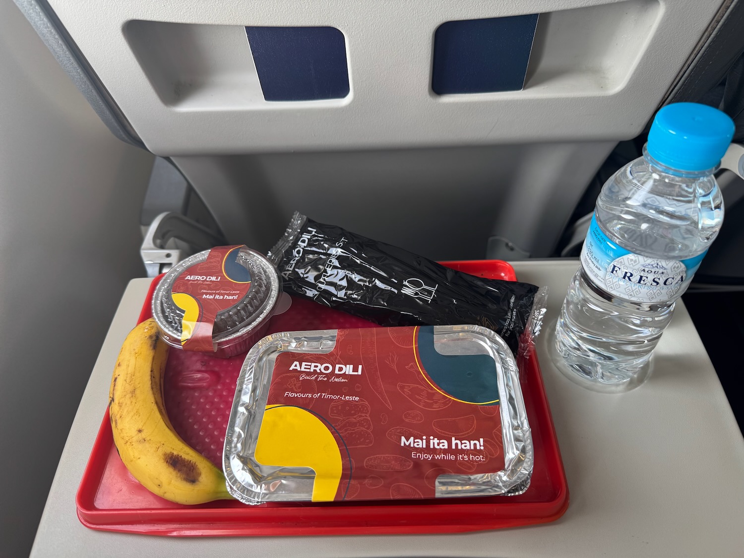 food on a tray on a plane
