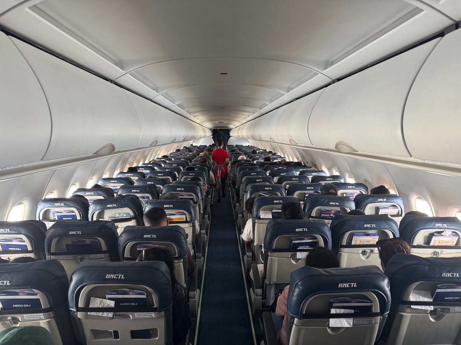 a person walking in an airplane