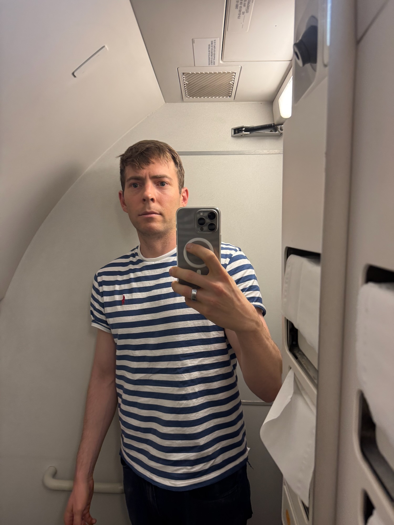 a man taking a selfie in an airplane