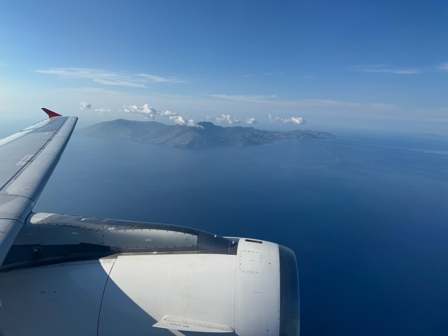 an airplane wing and the ocean