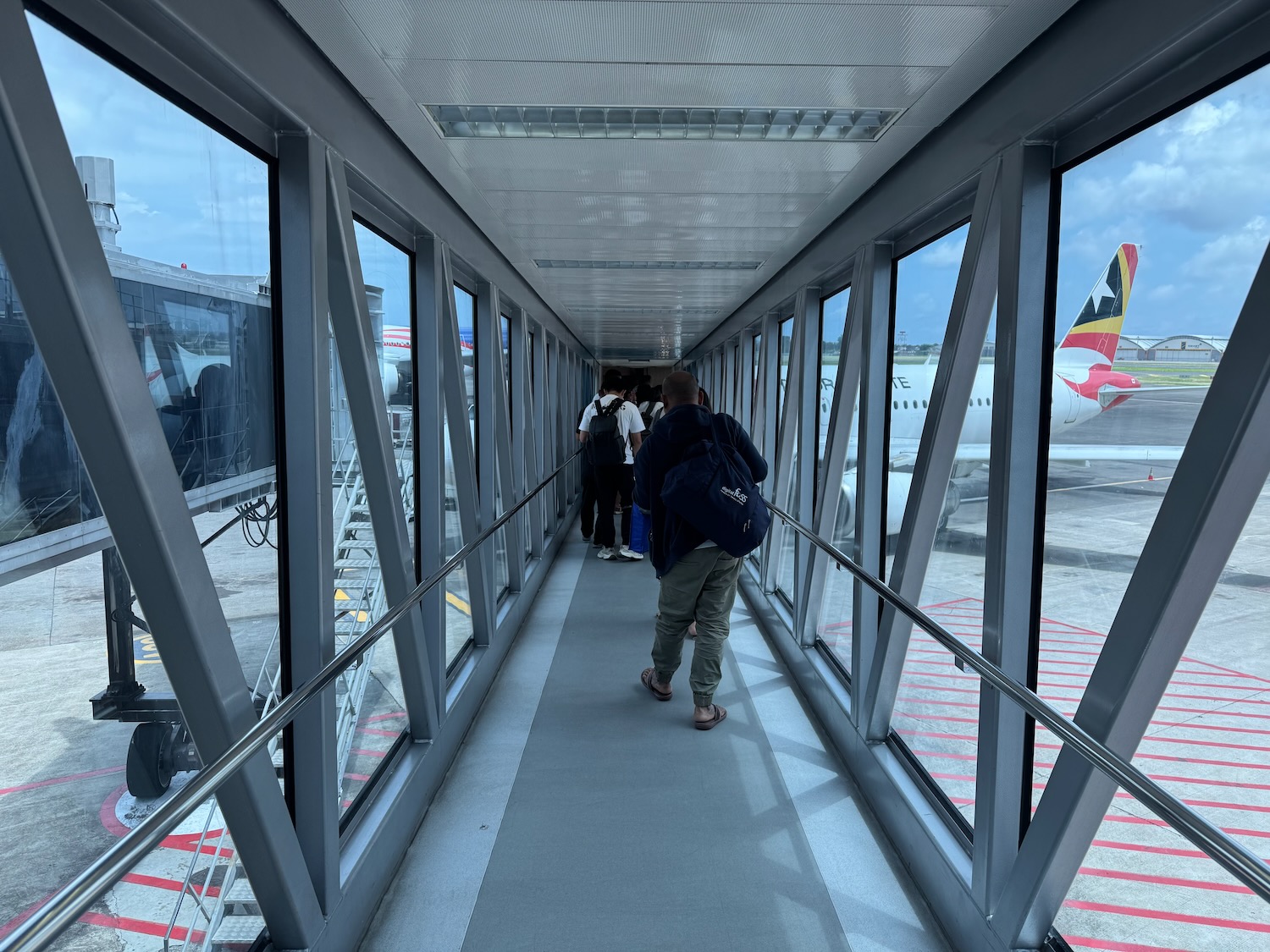 people walking on a walkway