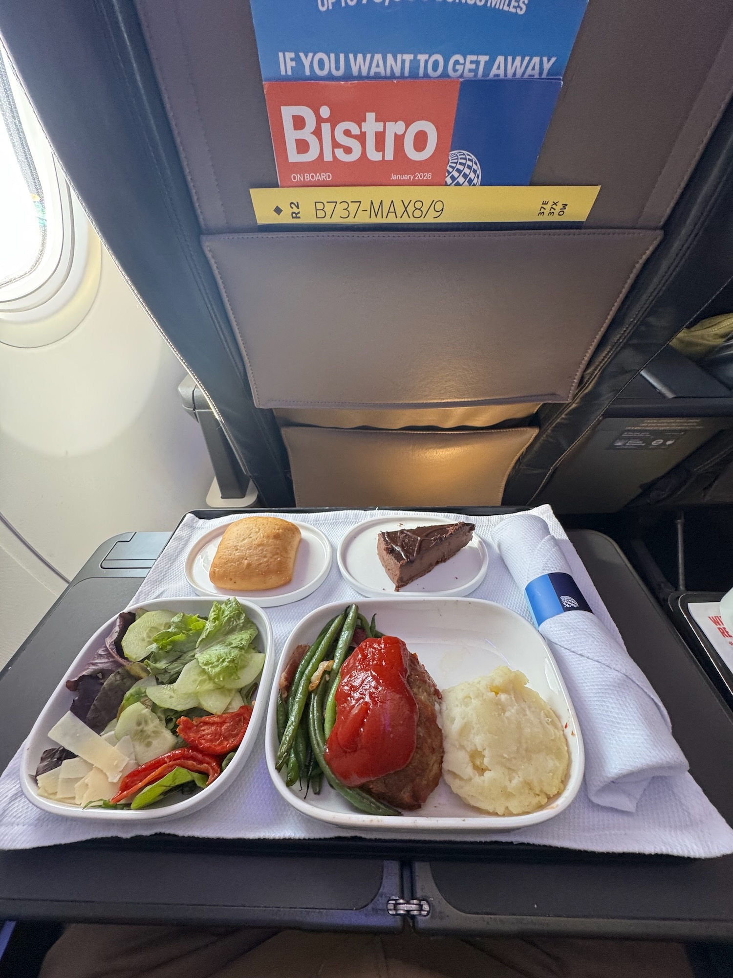 food on a tray on a plane