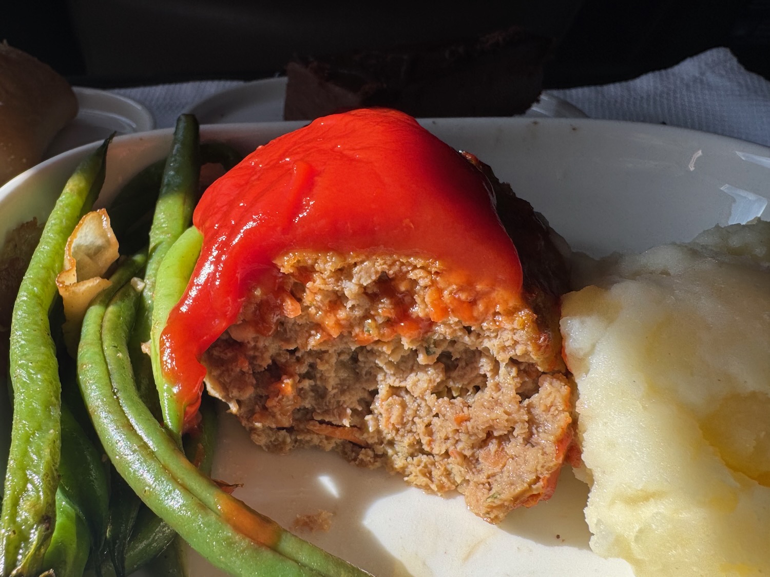 a plate of food with a bite taken out of it