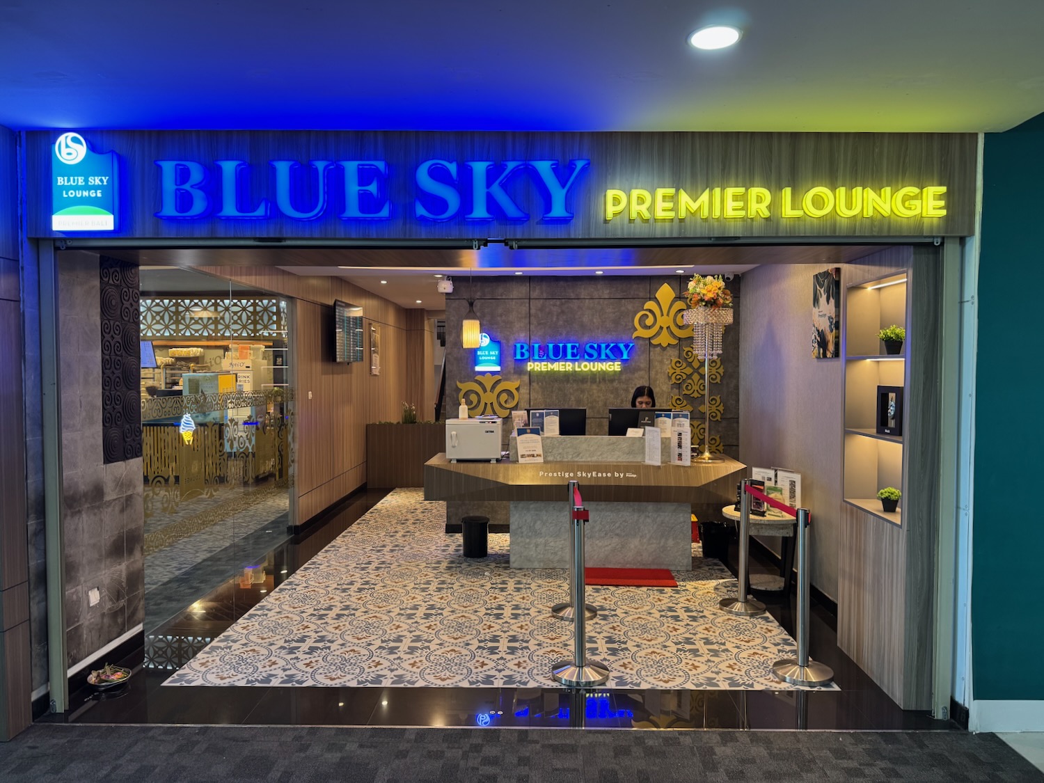 a store front with a desk and a sign