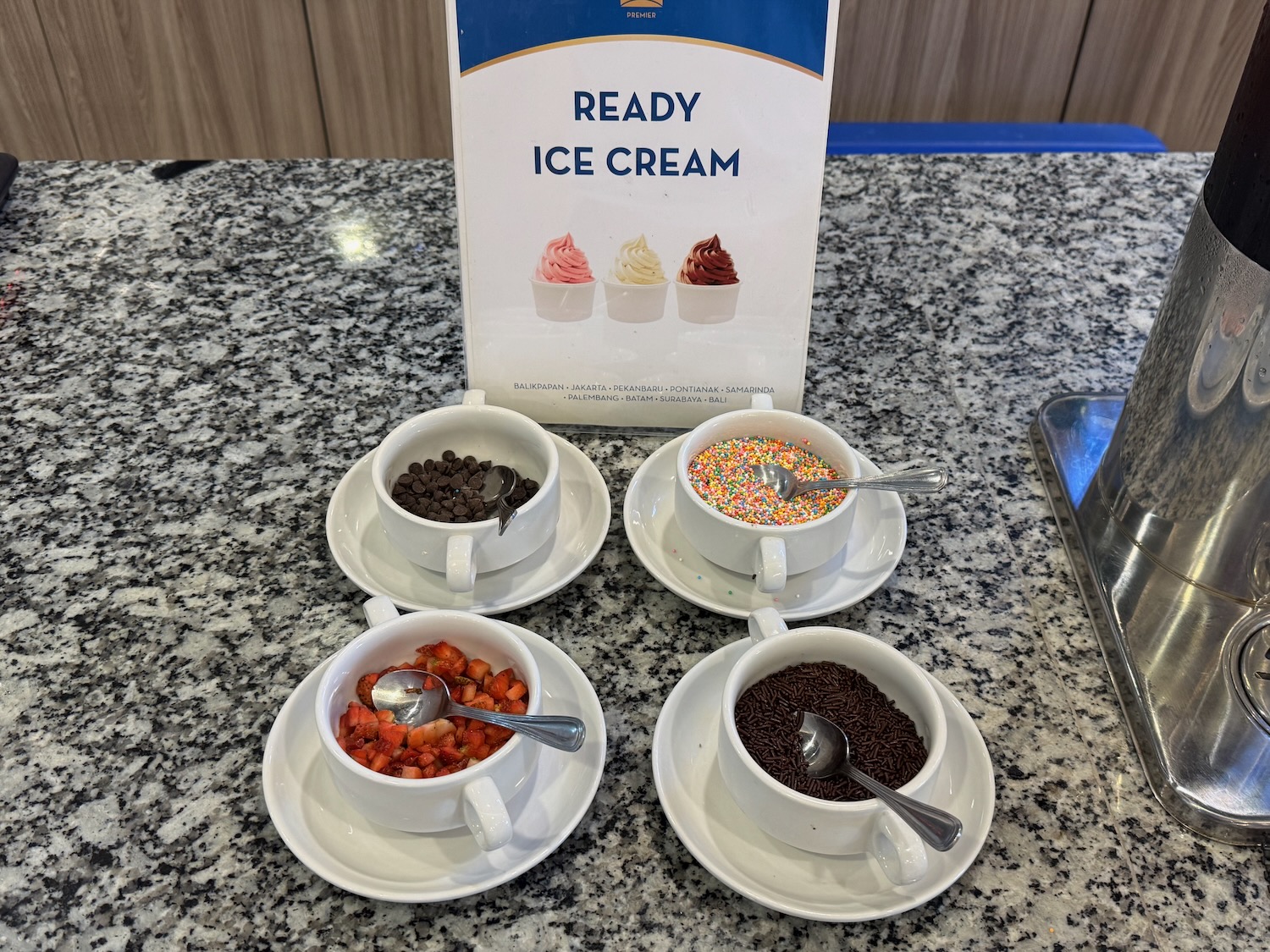 a group of cups with different toppings in bowls