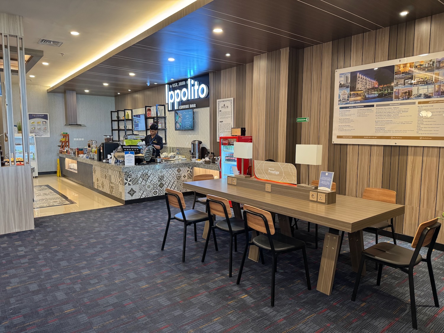 a restaurant with a counter and chairs