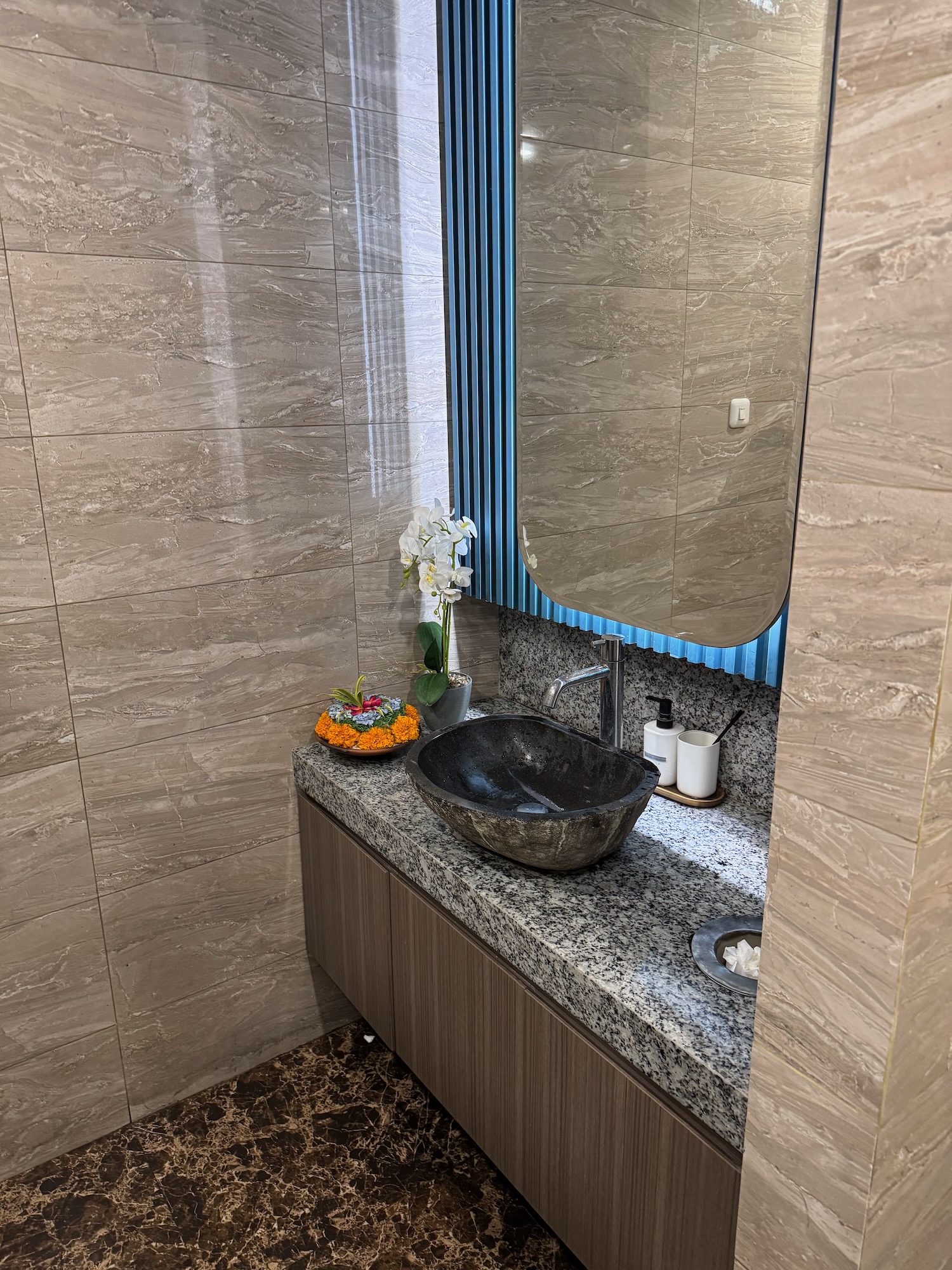 a sink with a mirror in a bathroom