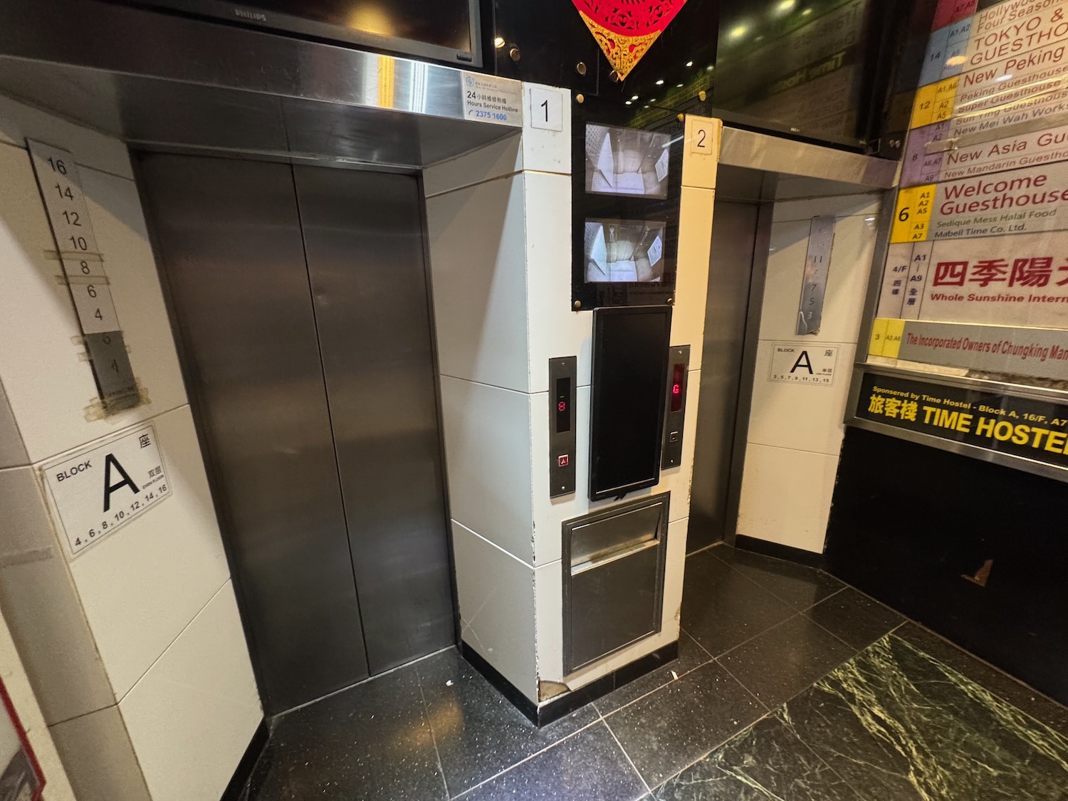 an elevator with a screen and a tv