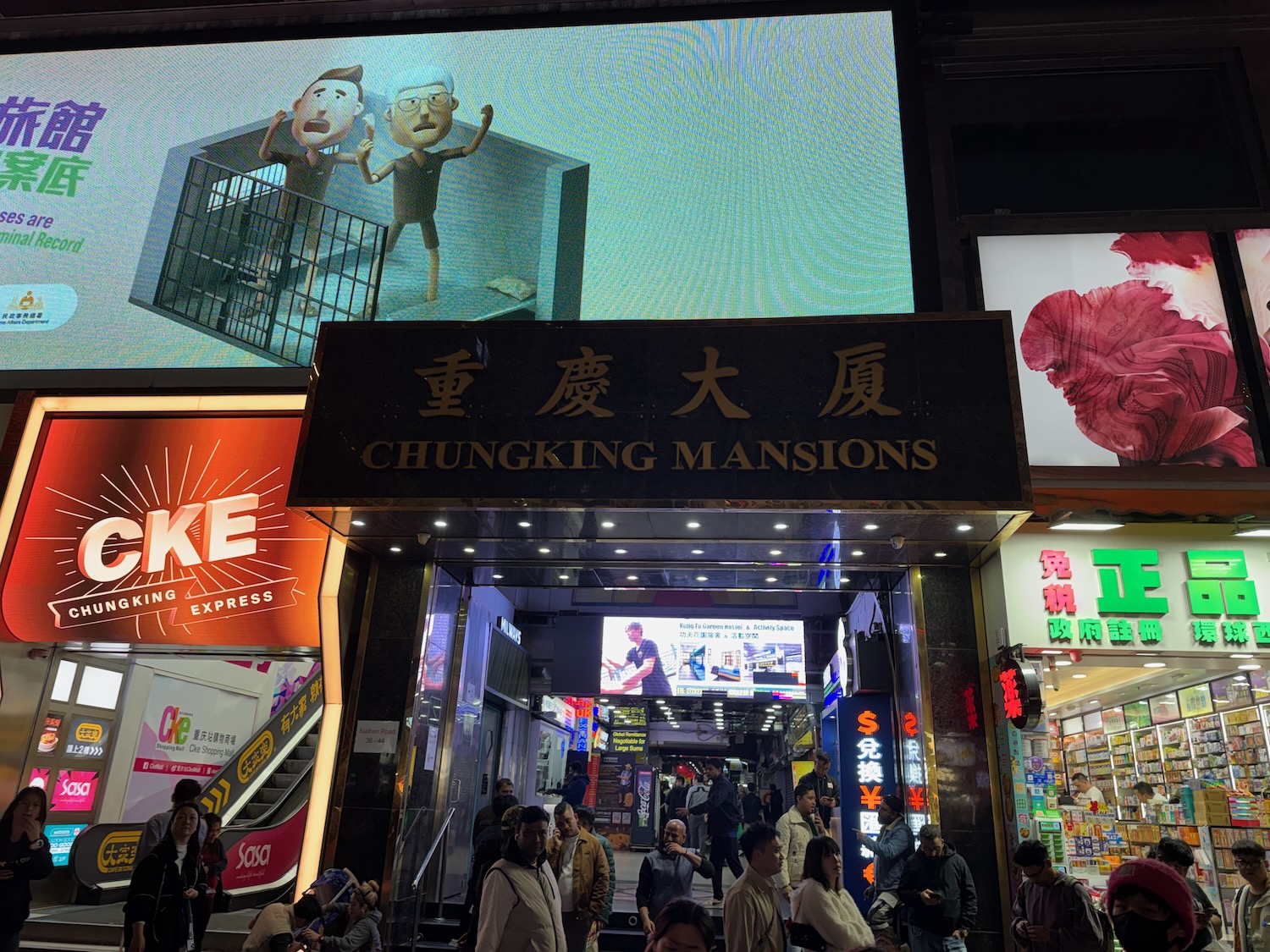 a group of people walking in front of a building