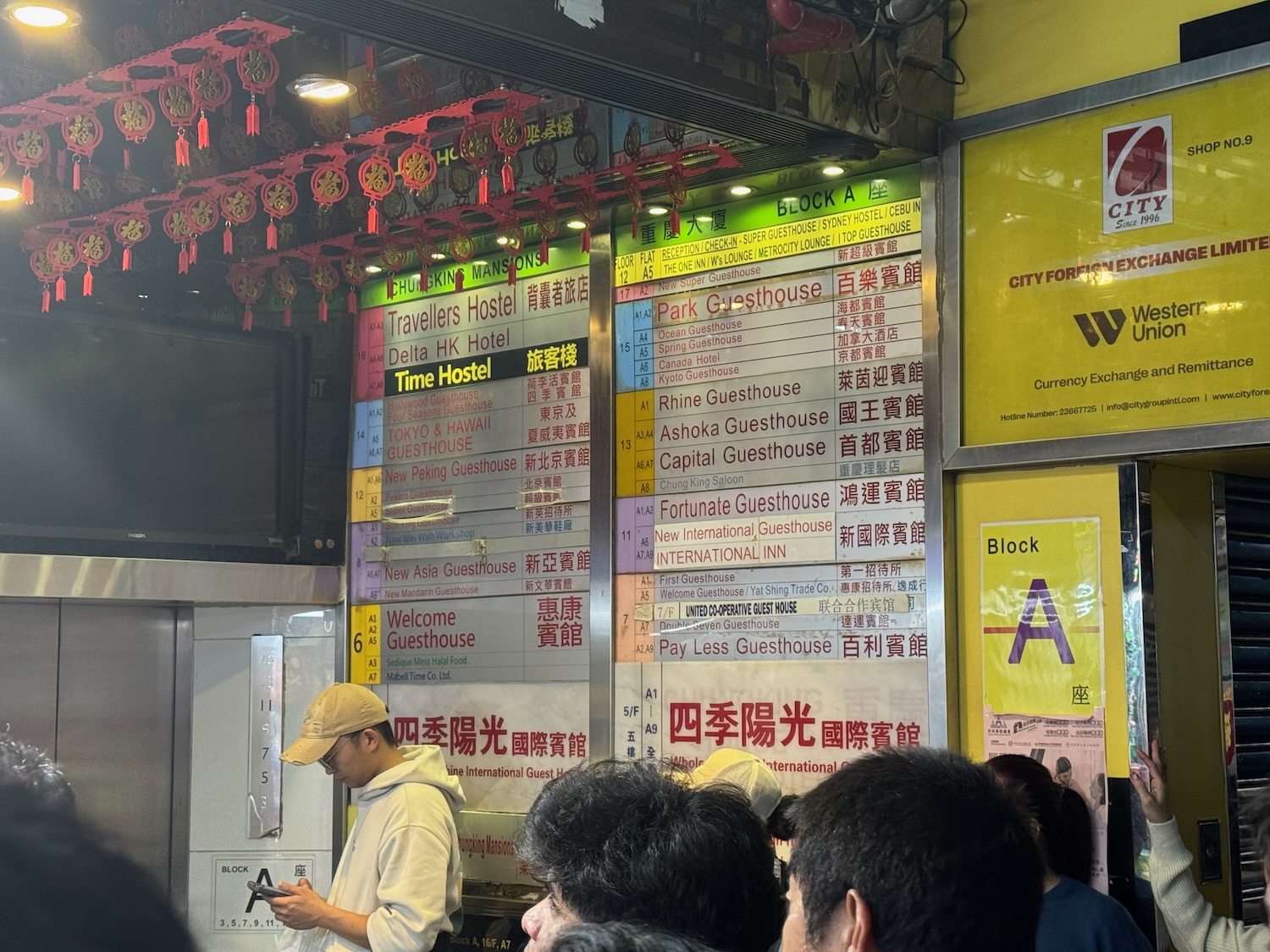 a group of people in a room with a sign