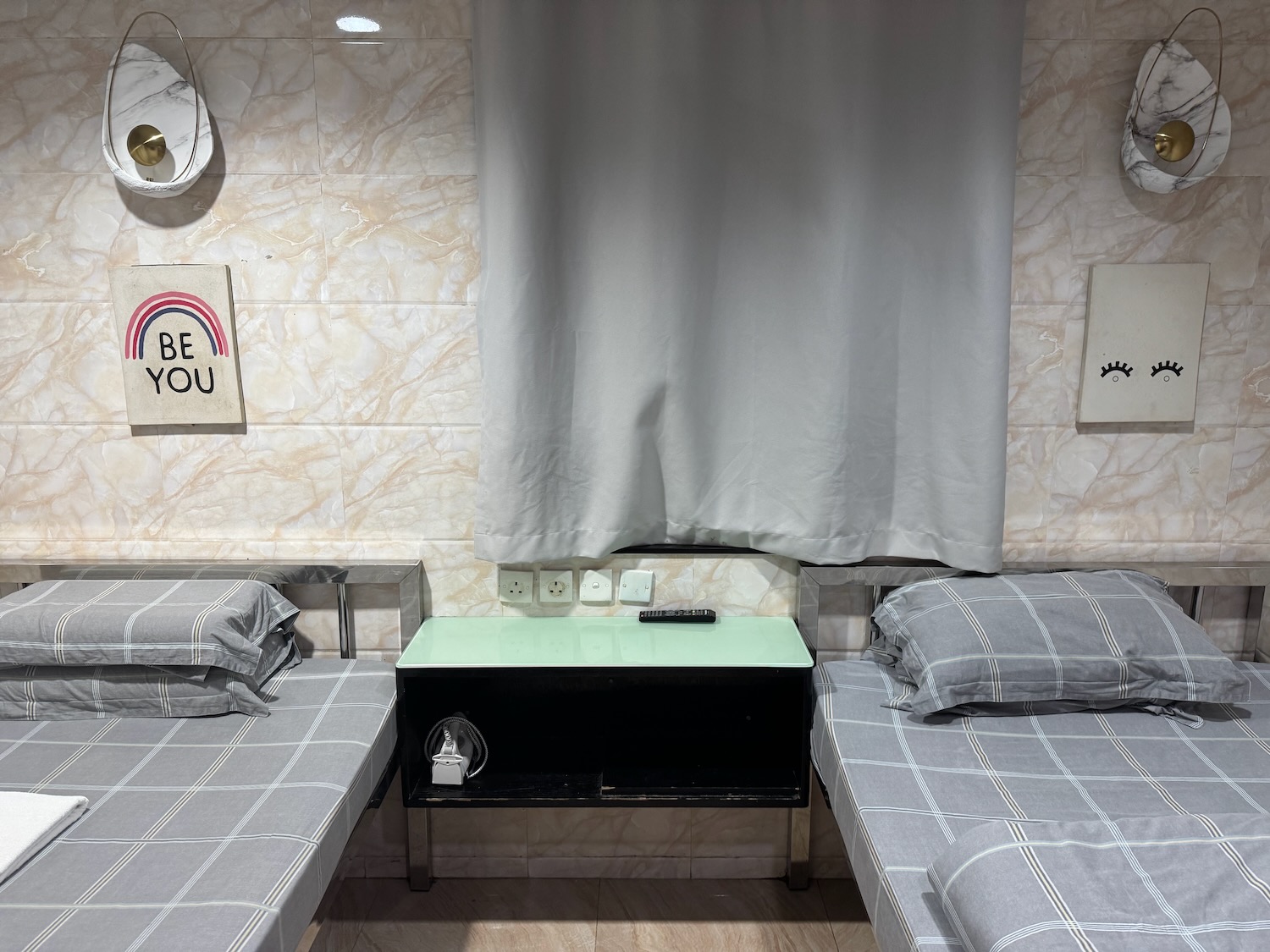 a room with two beds and a table