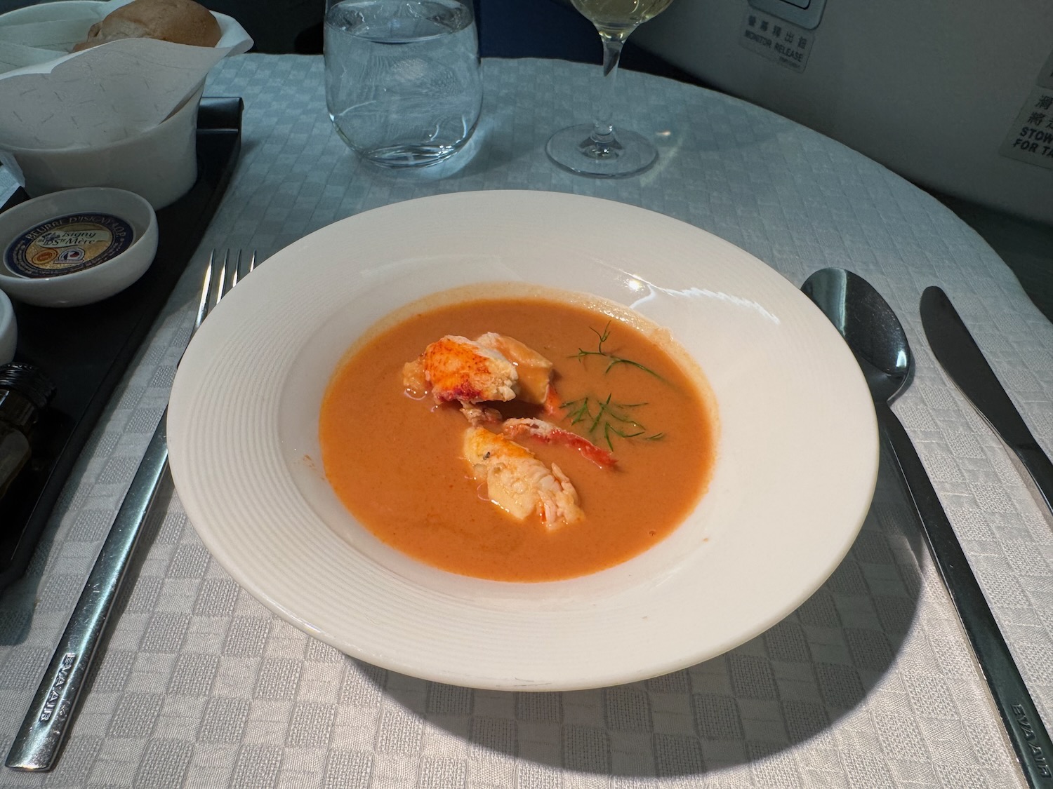 a bowl of soup with seafood on it