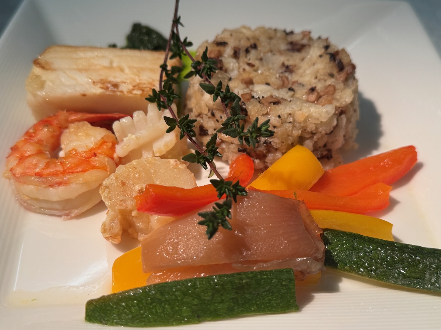 a plate of food on a white surface