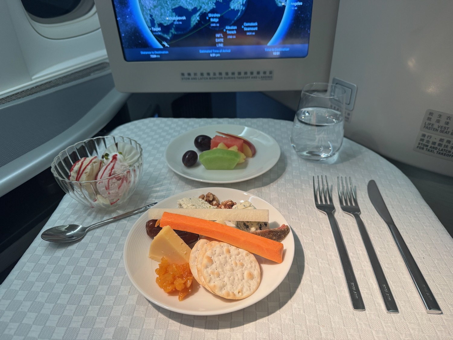 a plate of food on a table with a television
