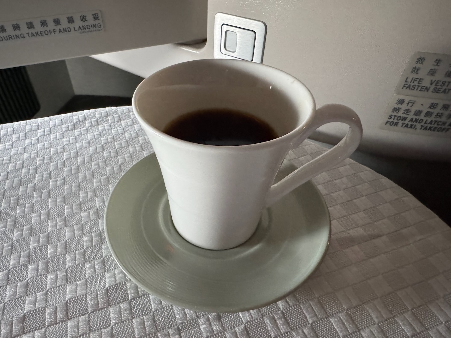 a cup of coffee on a saucer