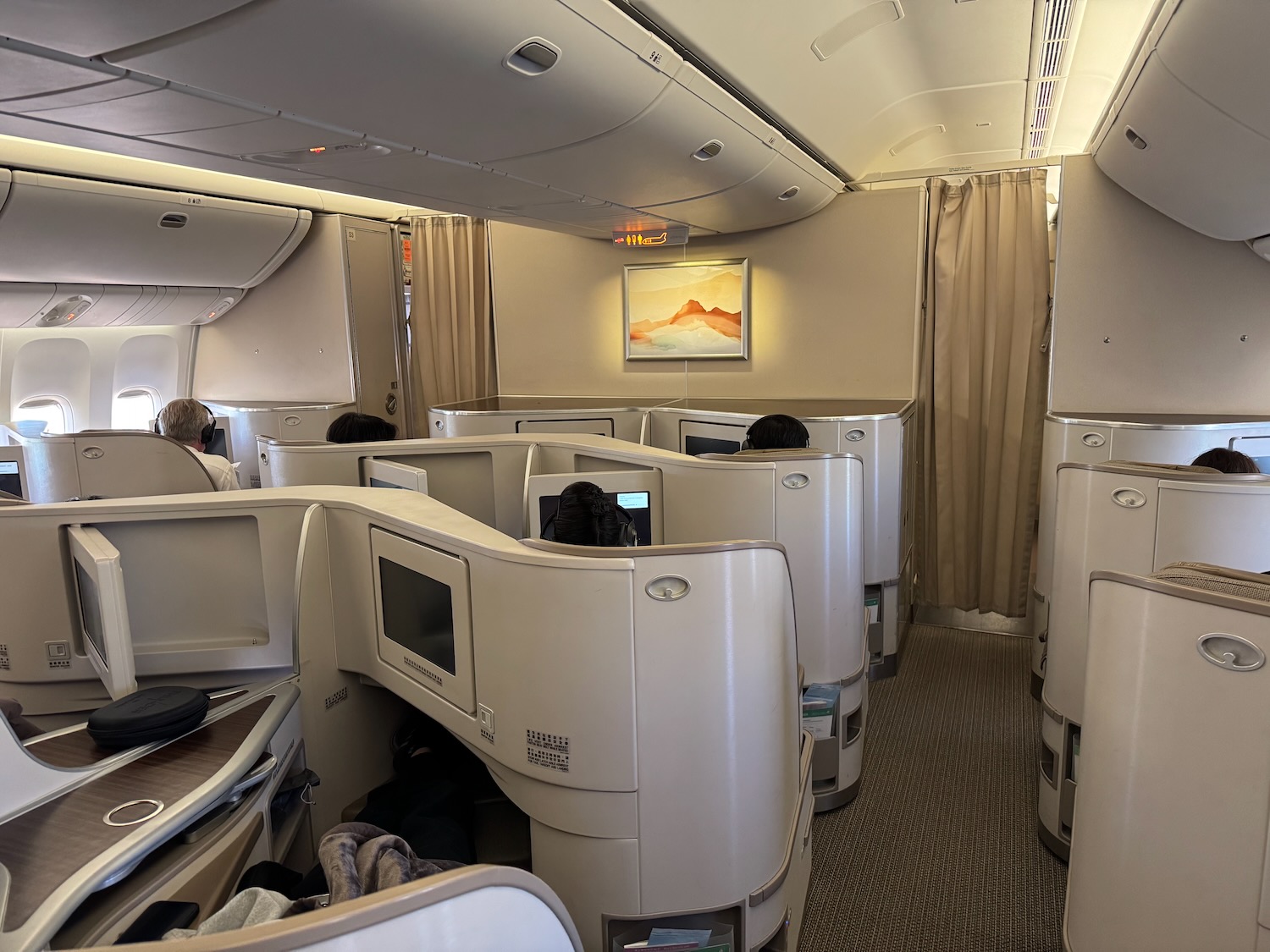 a group of people sitting in an airplane