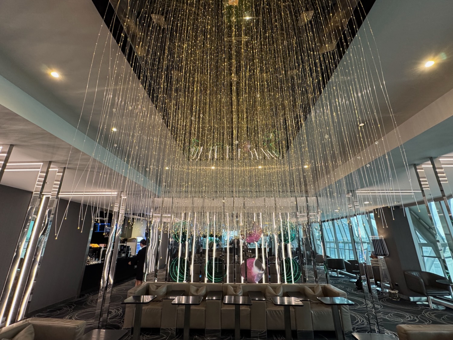 a room with a chandelier and tables