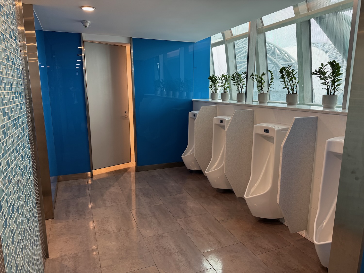 a row of urinals in a bathroom