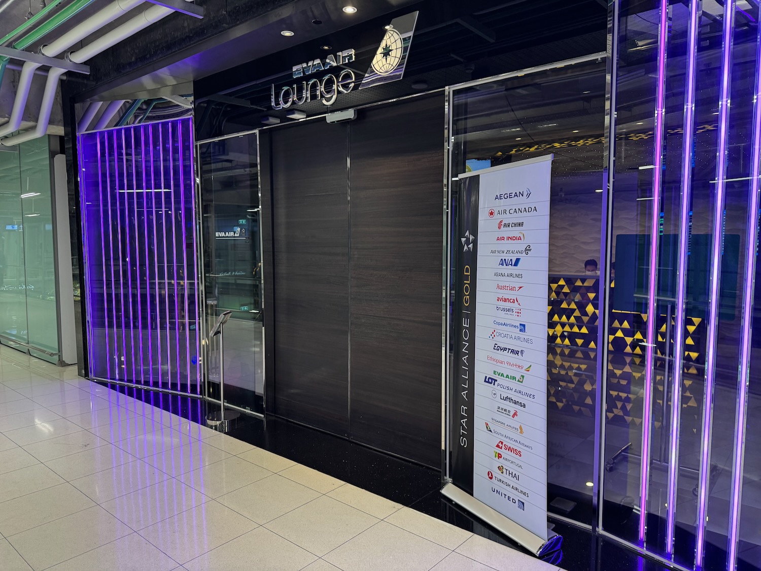 a store front with purple lights