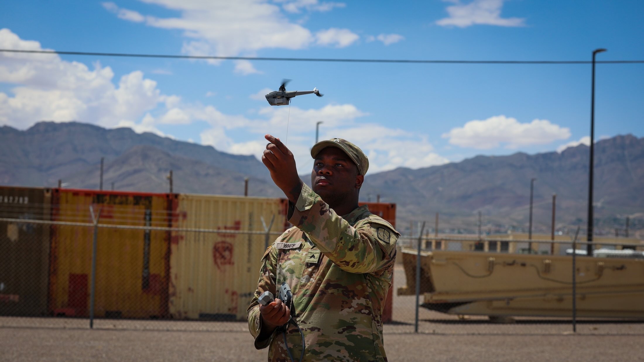 a US Army solider launches a drone from Fort Bliss