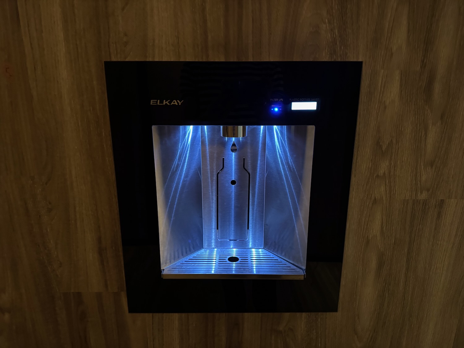 a water cooler with a blue light